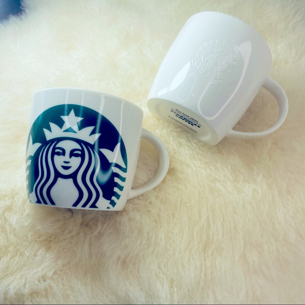 Two Starbucks coffee mugs.